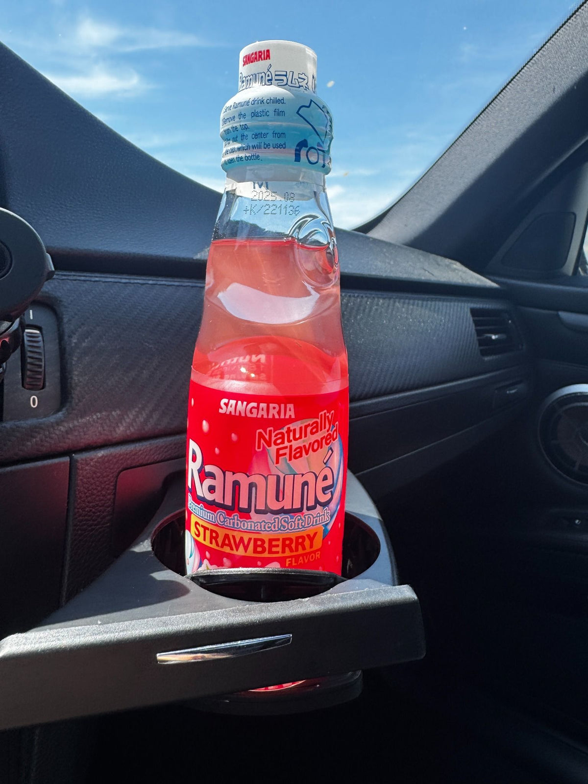 japanese soda ramune strawberry in the car
